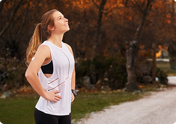 Woman wearing a sensor while in the middle of a run