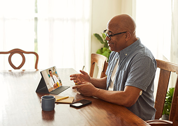 Man attending virtual classes on CGM