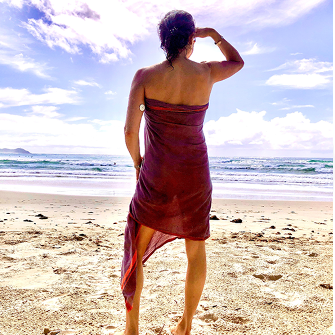 Rachel string a pose at the beach