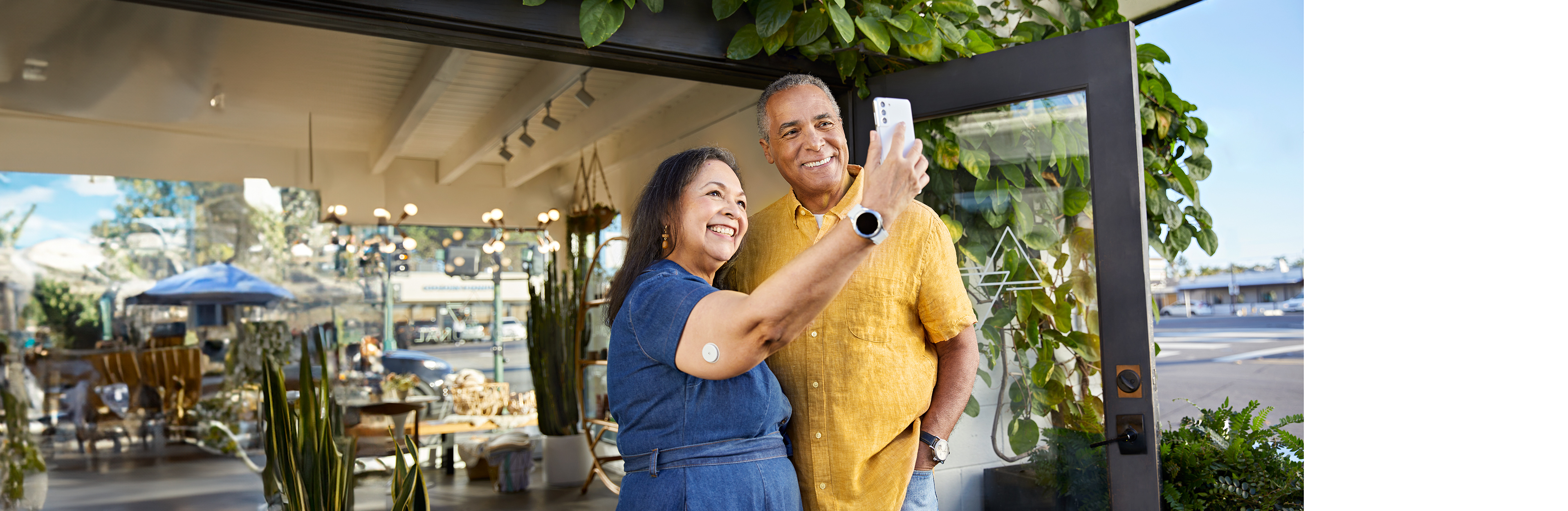 2 people smiling taking a selfie