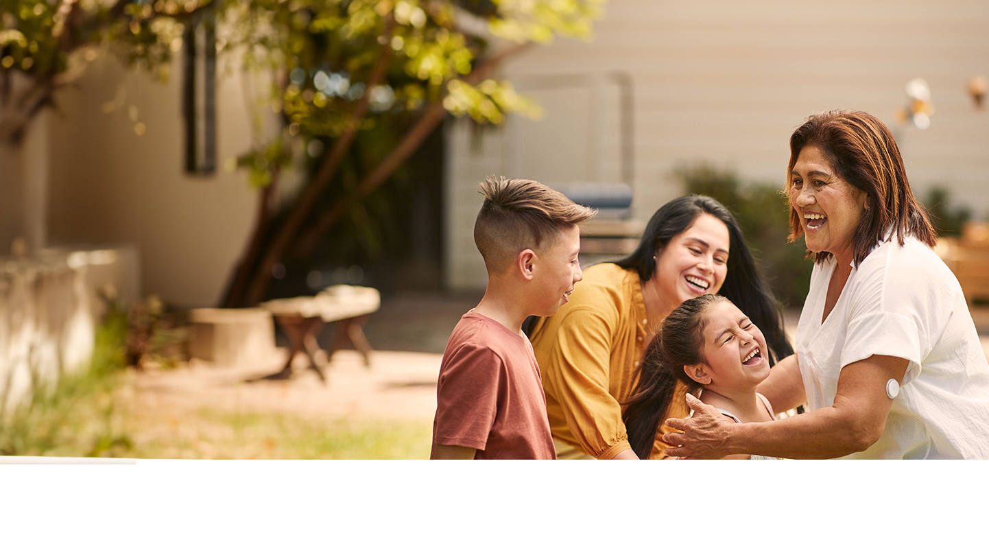 Woman wearing FreeStyle Libre sensor enjoying quality time with family